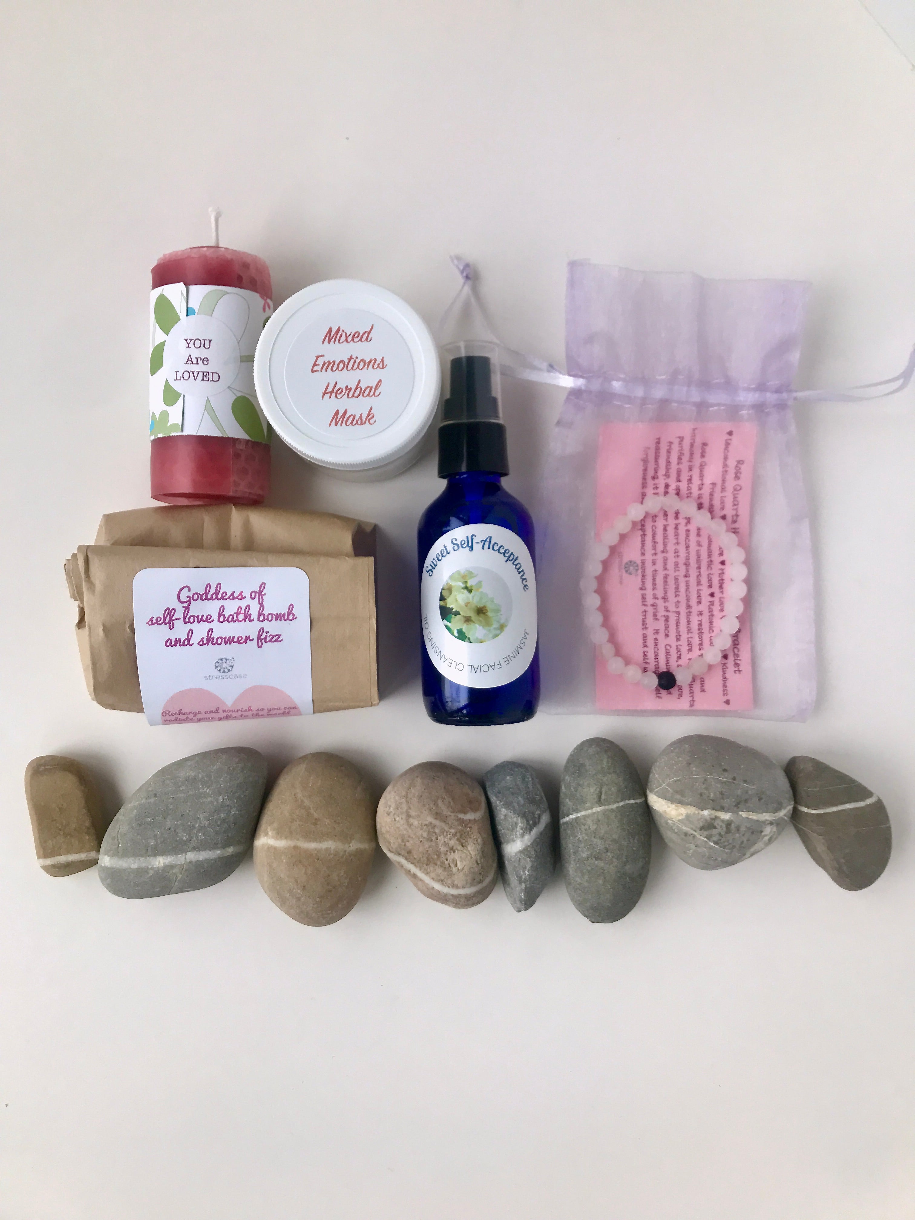 You Are Loved Beeswax Candle Mixed Emotions Herbal Mask Goddess of Self Love bath bomb and shower fizz Sweet Self-Acceptance Facial Cleansing Oil Rose Quartz Beaded Bracelet Stones show how we are all connected.
