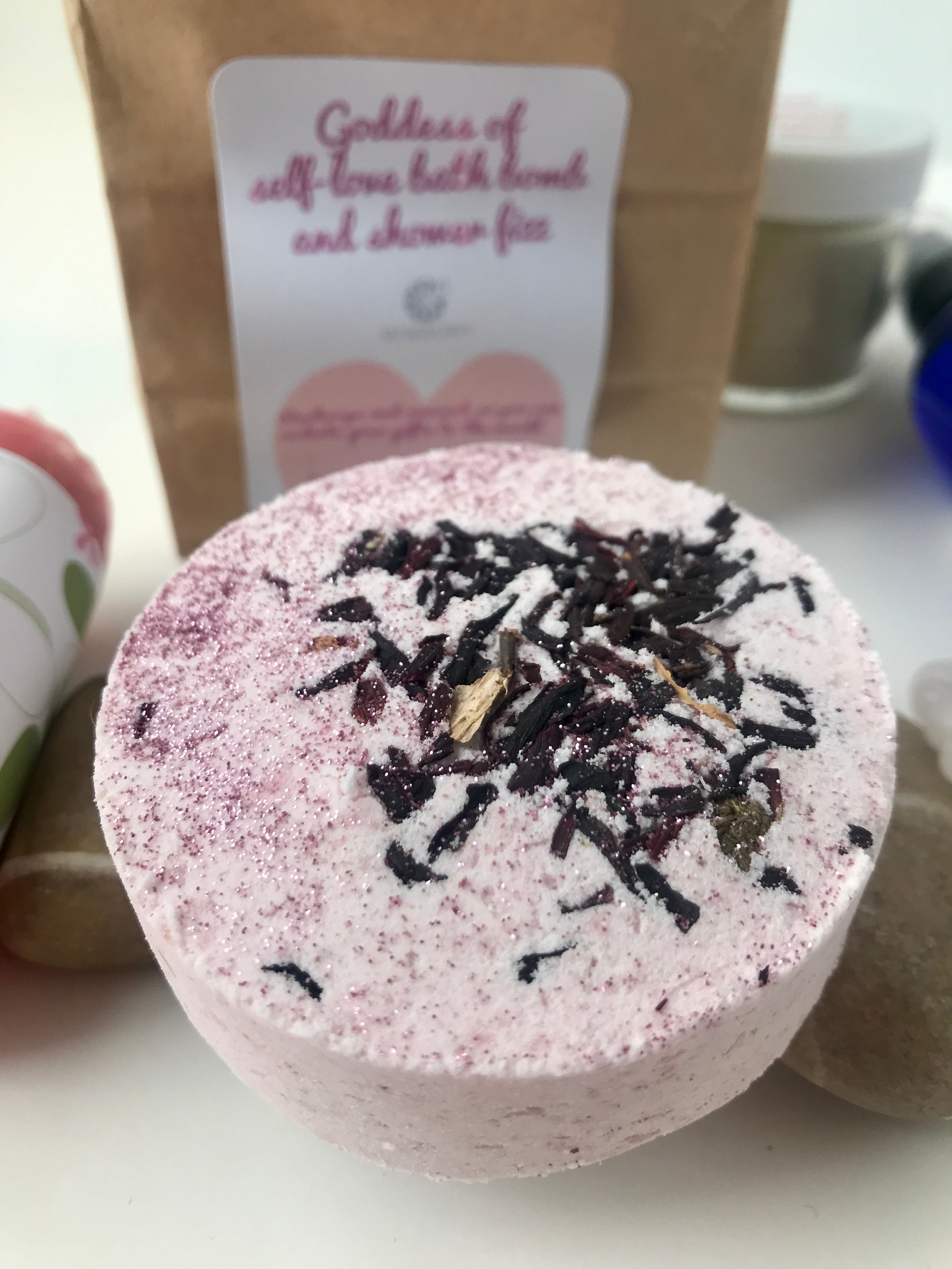 Goddess of Self-Love Bath Bomb with Ylang Ylang, Lavender and Bergamot Essential oils, all natural and cruelty free and sprinkled with eco-glitter and Hibiscus Flowers.